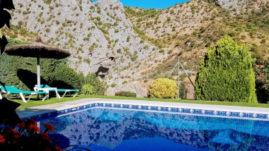 Terrace closed to the swimming pool at Casitas Cueva del Gato en Benaoján