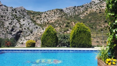 Terrace closed to the swimming pool at Casitas Cueva del Gato en Benaoján