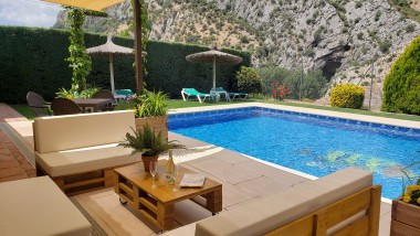 Terrace closed to the swimming pool at Casitas Cueva del Gato en Benaoján