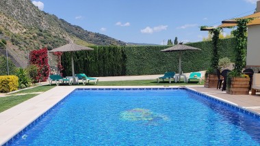 Terrace closed to the swimming pool at Casitas Cueva del Gato en Benaoján