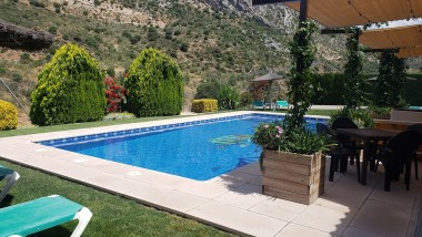 Terrace closed to the swimming pool at Casitas Cueva del Gato en Benaoján