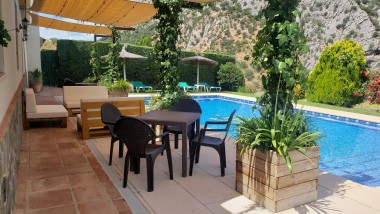 Terrace closed to the swimming pool at Casitas Cueva del Gato en Benaoján