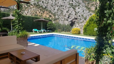 Terrace closed to the swimming pool at Casitas Cueva del Gato en Benaoján