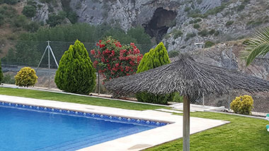 Terrace closed to the swimming pool at Casitas Cueva del Gato en Benaoján