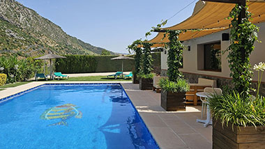 Terrace closed to the swimming pool at Casitas Cueva del Gato en Benaoján