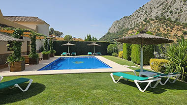 Terrace closed to the swimming pool at Casitas Cueva del Gato en Benaoján